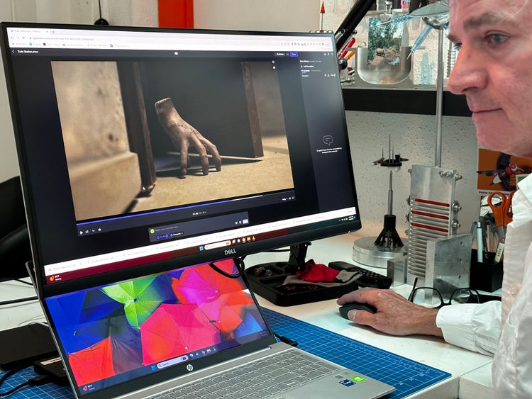 Still image from Netflix’s Emmy-nominated “Wednesday”. Kent Johnson at work on his computer.