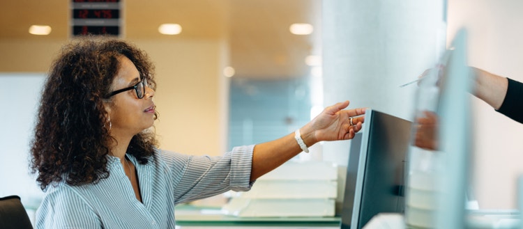 Woman looking at computer screen.