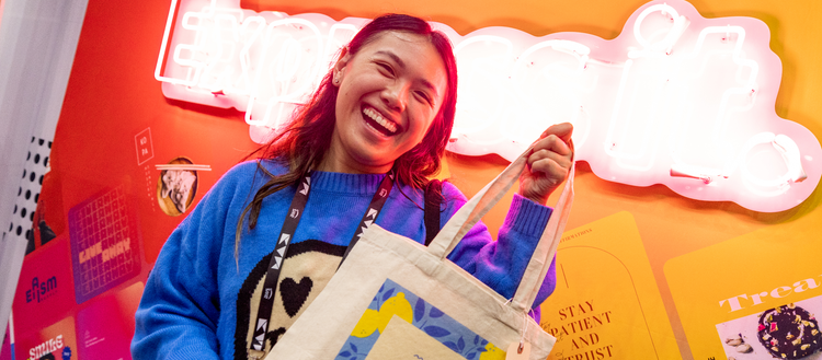 Woman holding canvas tote bag