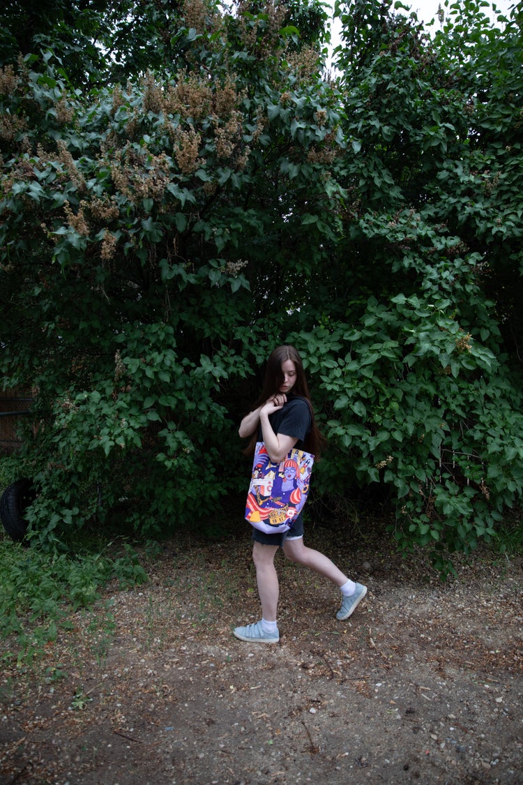 Image of a girl holding a bag.