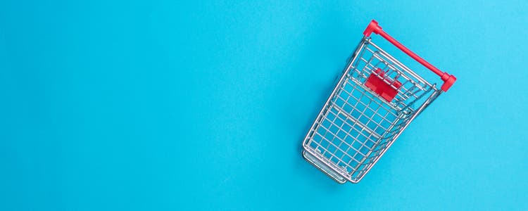 Shopping cart against blue backgroud.