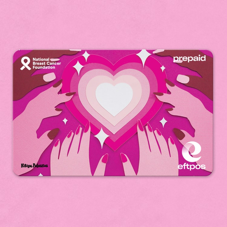 Gift card with hands reaching towards a heart design on it