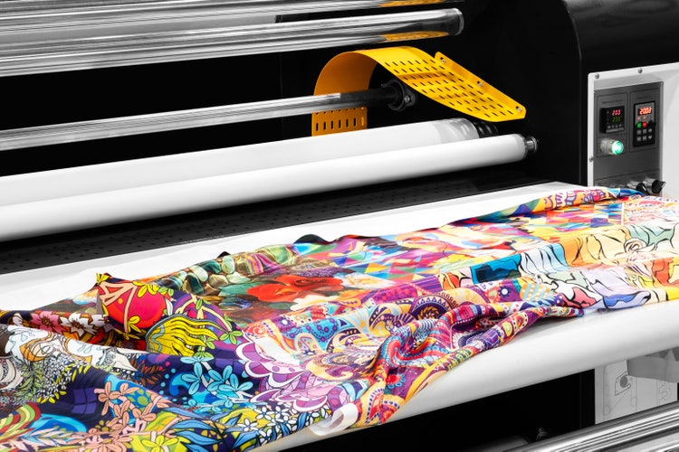 Printer printing on fabric.