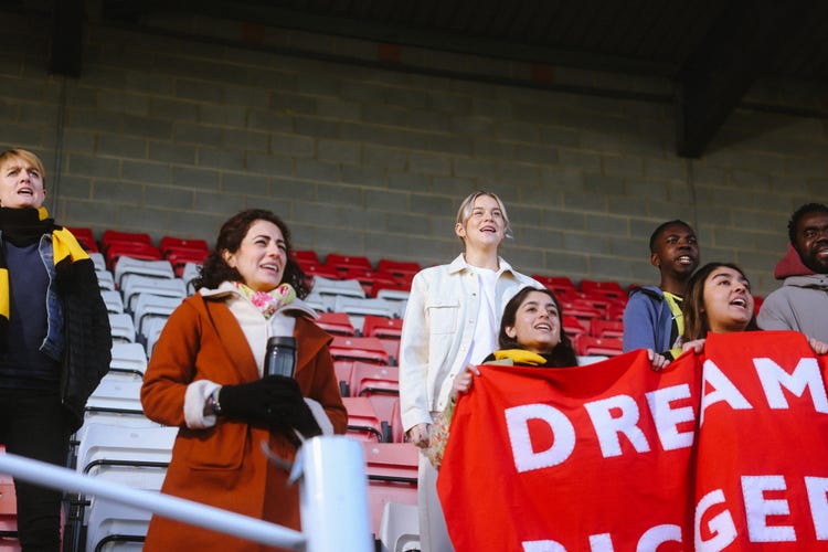 Image of fans at a womens football match.