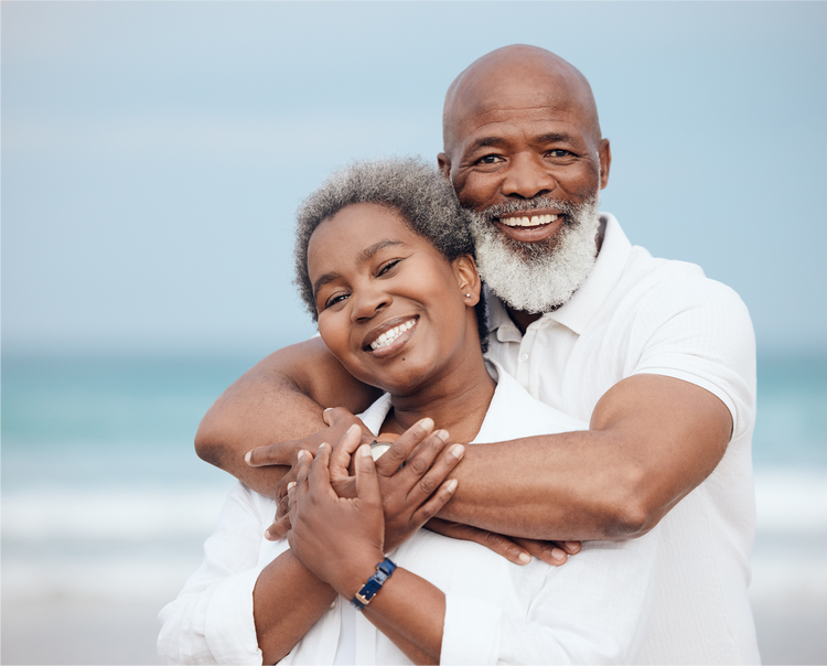 Couple embracing at the beach.