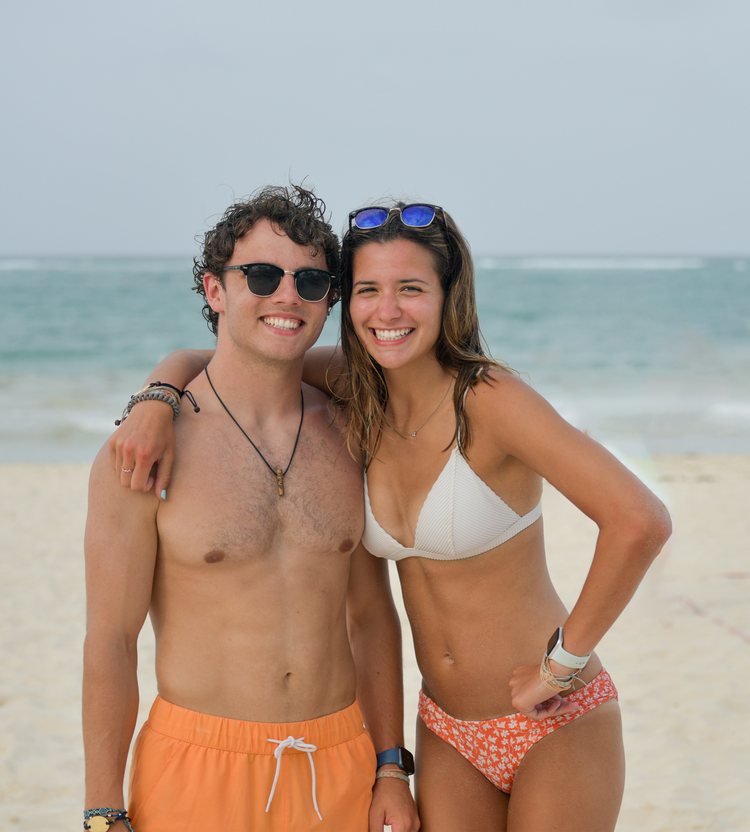 Couple standing on the beach.