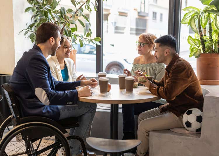 Group meeting at a table.