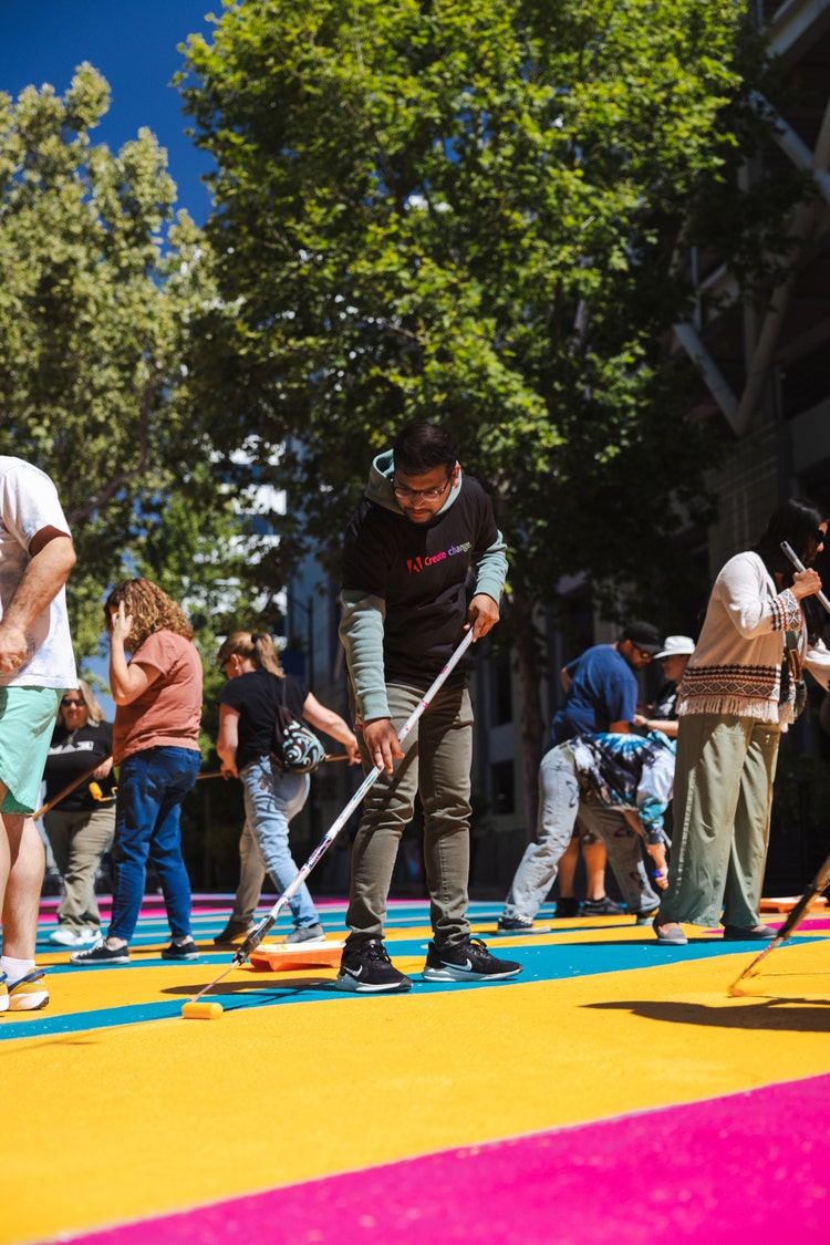 Group of people helping to paint.