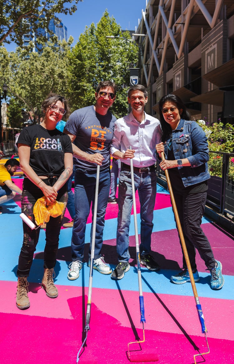 Group of people helping to paint.