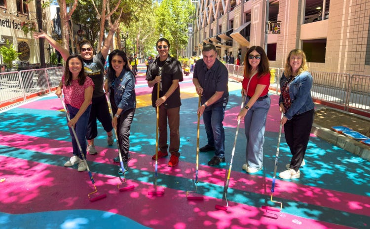 Group of people helping to paint.
