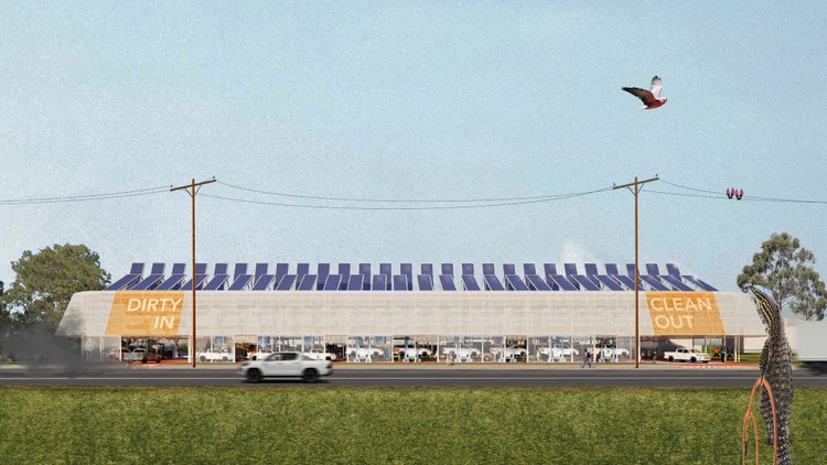 Futuristic car warehouse with solar panel roof.