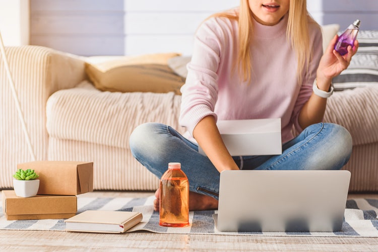 Image of woman on her laptop buying cosmetics.