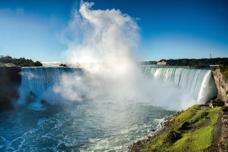 Photograph of mist-shrouded waterfalls of Niagara Falls.