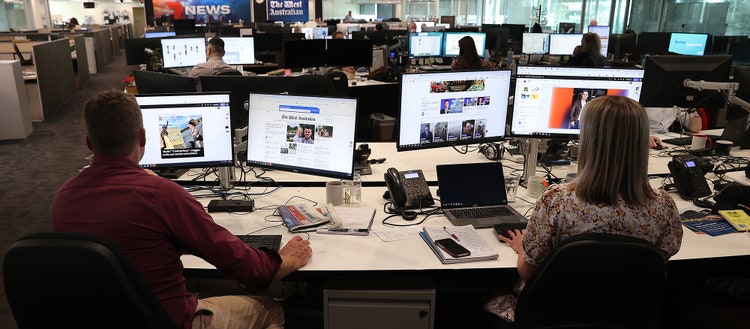 Seven West Media working on desk top computers.