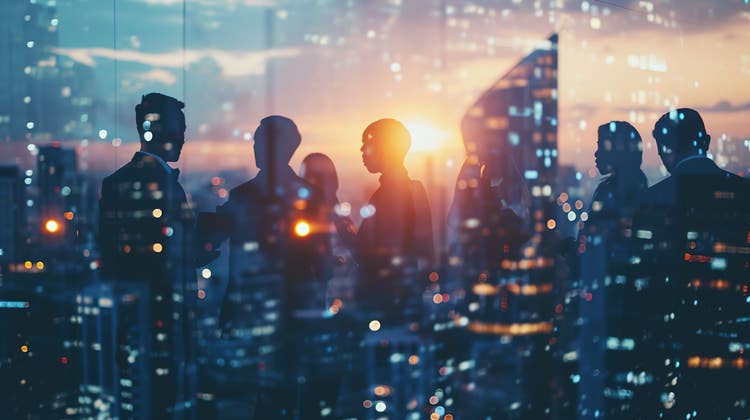 Silhouette of group of people meeting at sunset.