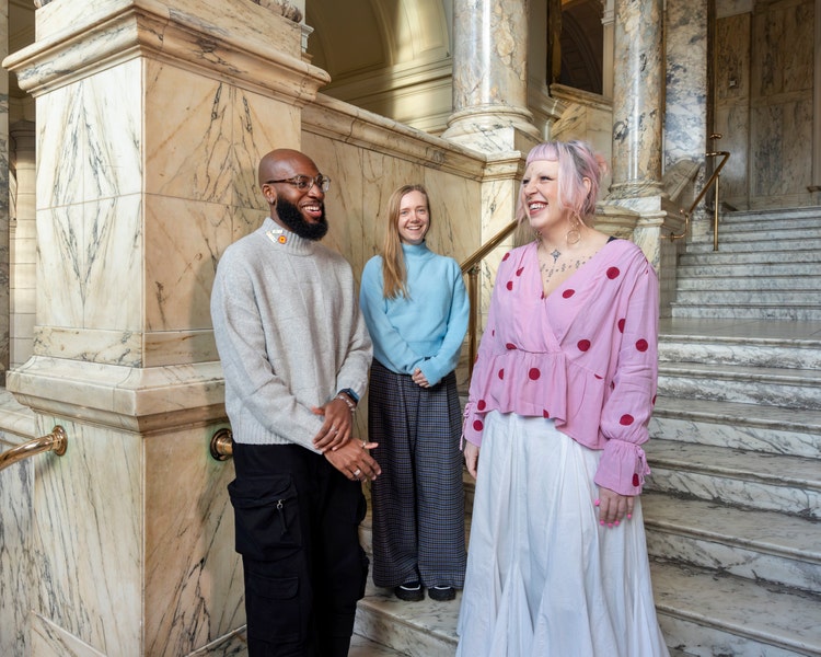 3 people outside the museum at Victoria and Albert Museum, London. 2025.