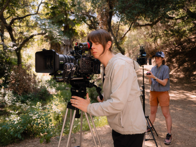 Woman using a FujiFilm Camera