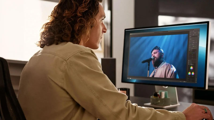 Man doing post production on a computer