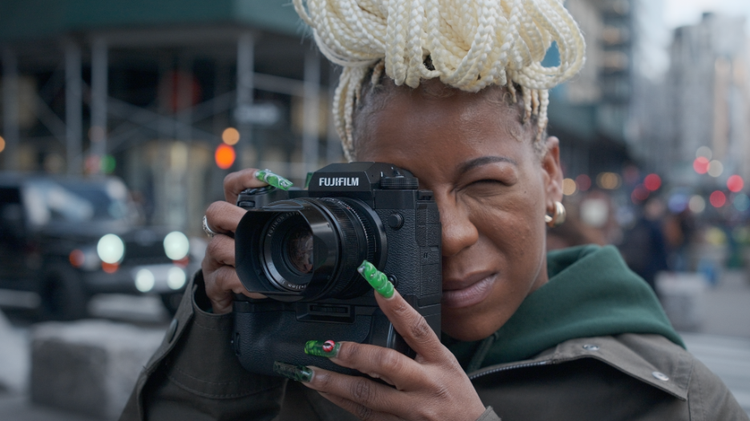 Woman using a FujiFilm Camera