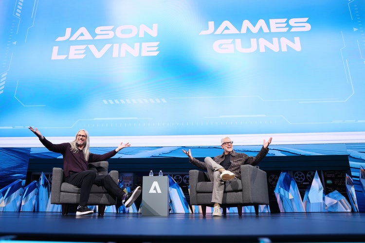 Two people on stage at Adobe MAX