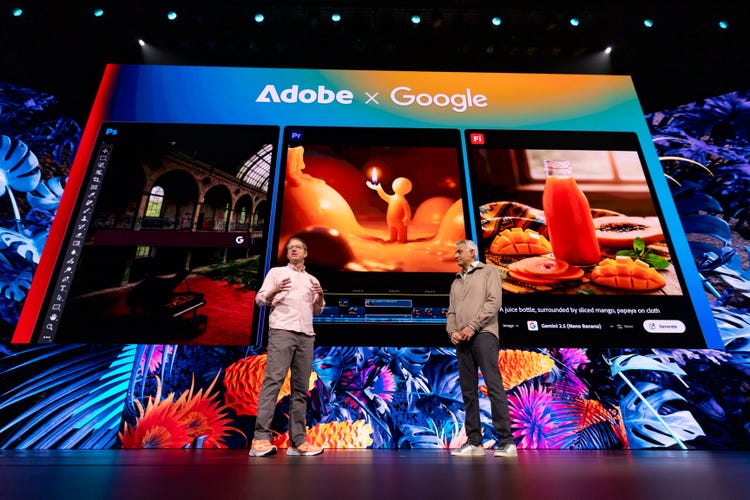 Two people on stage at Adobe MAX