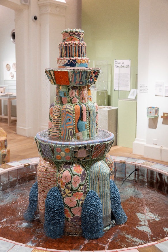 A water fountain with colorful objects AI-generated content may be incorrect.