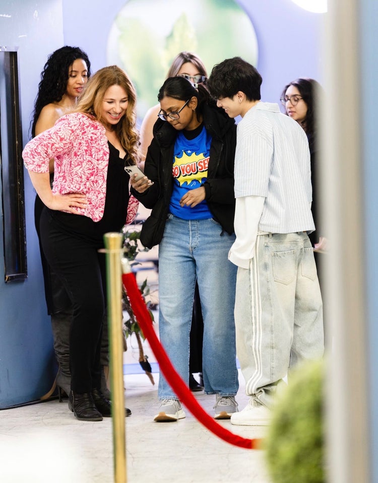 Creator Mentor Alan Chikin Chow and a Creator Training Camp attendee collaborate inside Dhar Mann Studios.