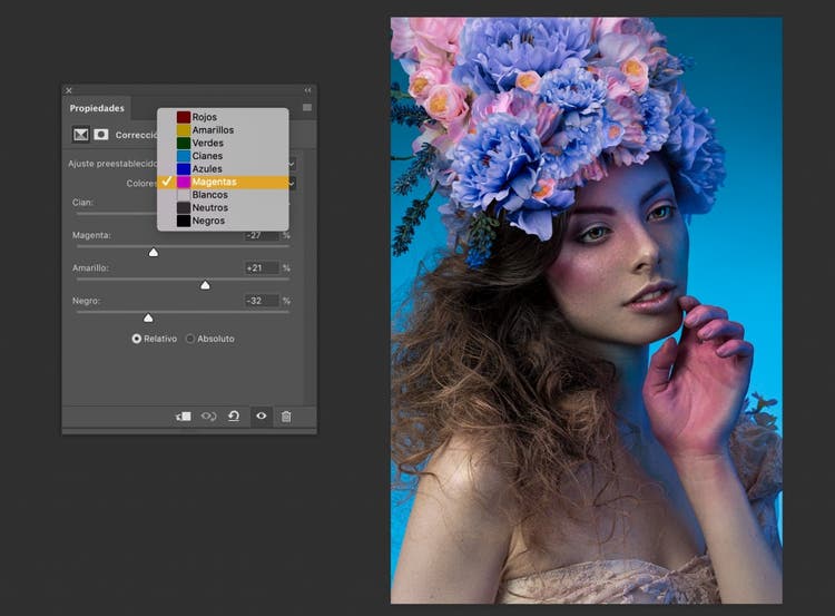 correcion selectiva en Photoshop de una fotografia del rostro de una mujer sobre su cabeza un ramo de flores de color rosa y morado