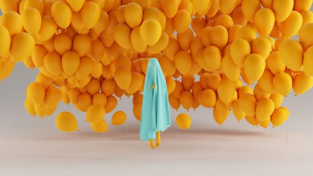 persona debajo de una manta azul clara y sobre esta persona muchos globos color amarillo expresion disruptiva 