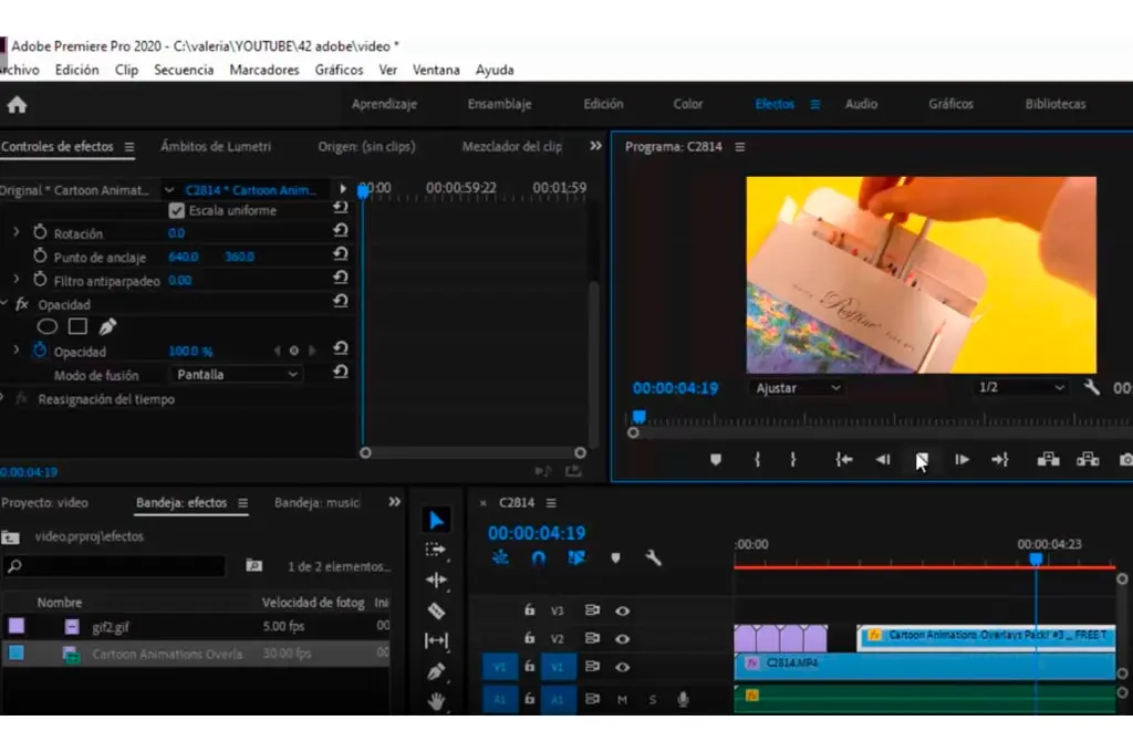 Controles de efectos en la interfaz de adobe premiere pro edicion de video de una caja de colores con una mano humana