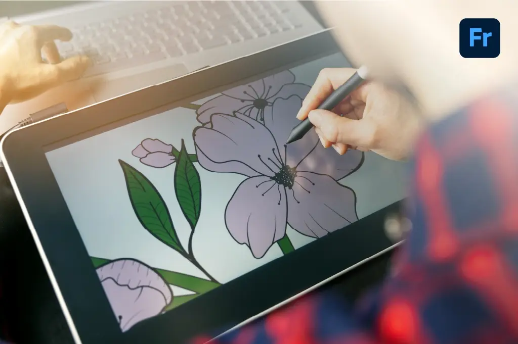 disenador trabajando una ilustracion de unas flores en su ipad desde la interfaz de Adobe Fresco