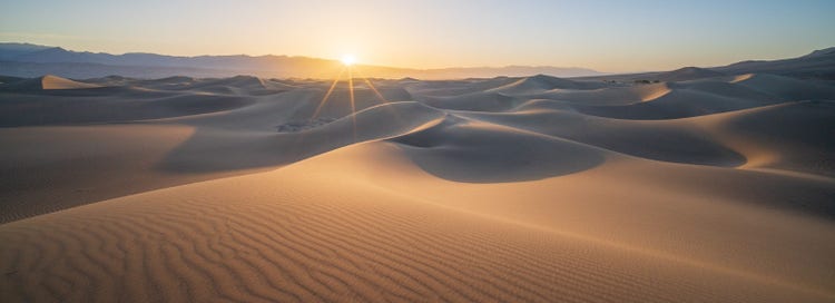 Sun shining on desert sand.