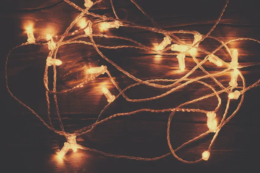 Christmas lights garland on a old antique wooden parquet floor,