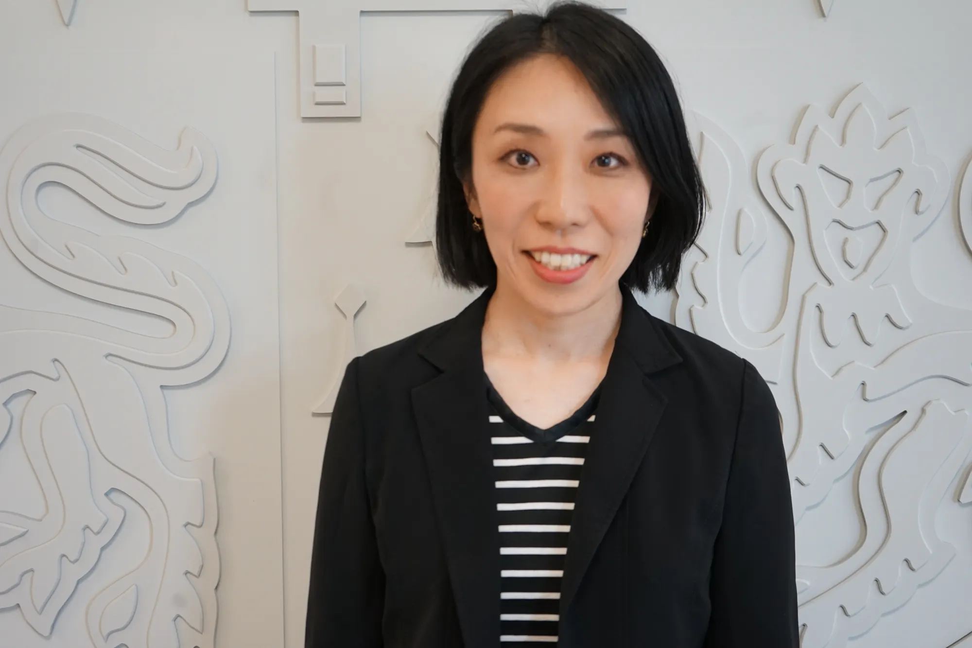 A picture containing person, posing, dressed Description automatically generated