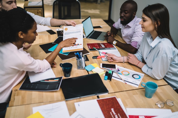 Diverse group of office workers doing a project