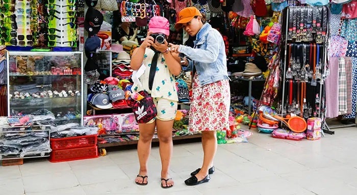 A person taking a picture of a person in a hat
Description automatically generated with low confidence