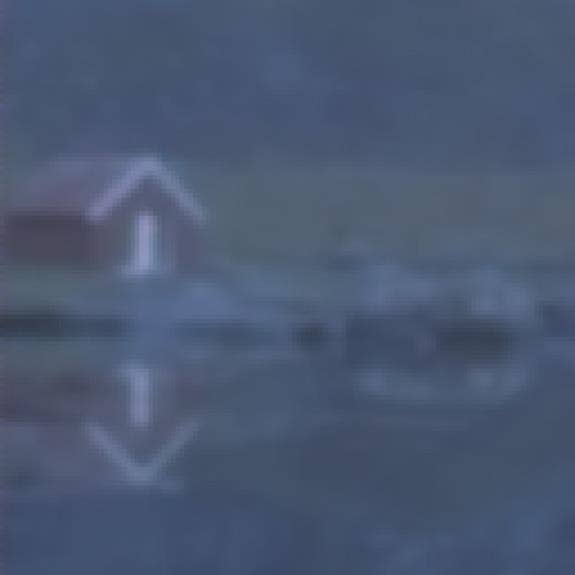 A blurry image of a building Description automatically generated with low confidence
