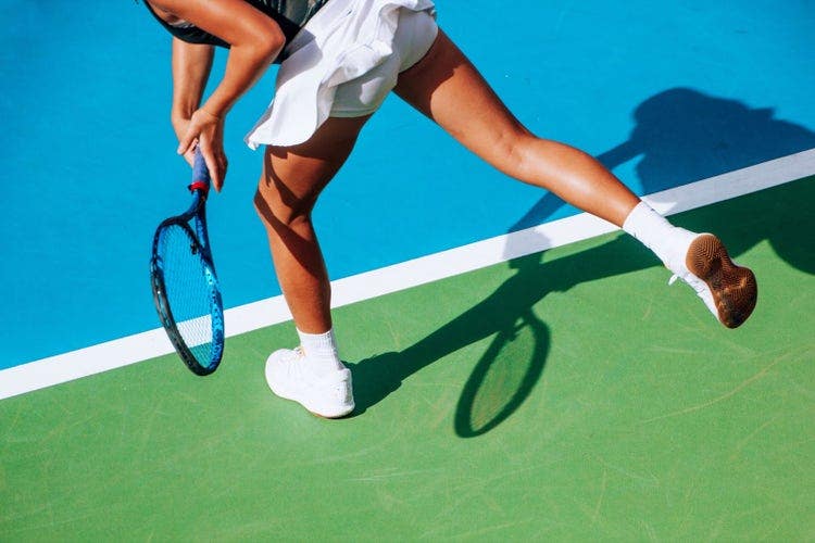 Low Section Of Woman Playing Tennis