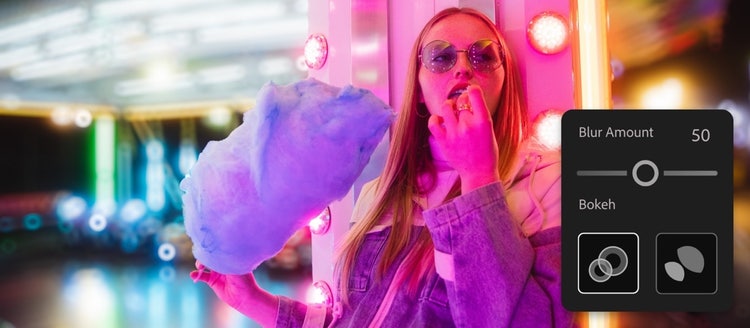 A person eating a cotton candy Description automatically generated