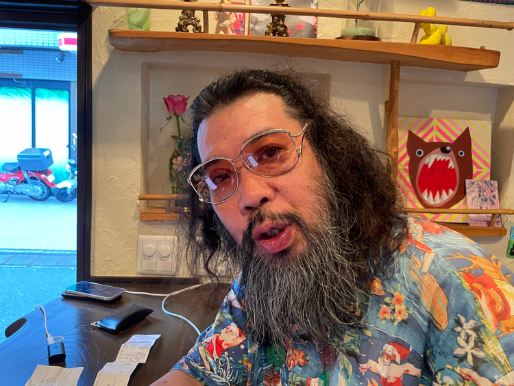 A person with long hair and a beard AI-generated content may be incorrect.