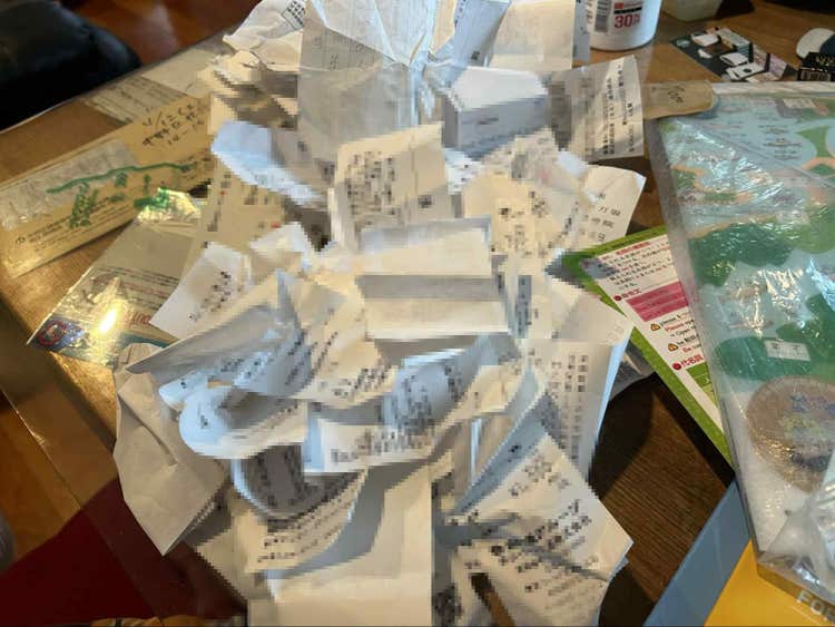 A pile of paper on a table AI-generated content may be incorrect.